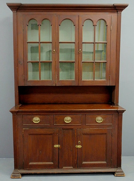 Appraisal: Pine two-piece Dutch cupboard with cherry stain the upper section