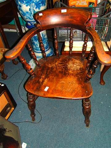 Appraisal: A Windsor smokers bow chair with elm saddle seat and