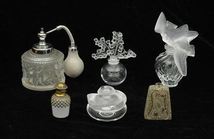 Appraisal: Three Lalique Molded Glass Scent Bottles Together with a Lalique