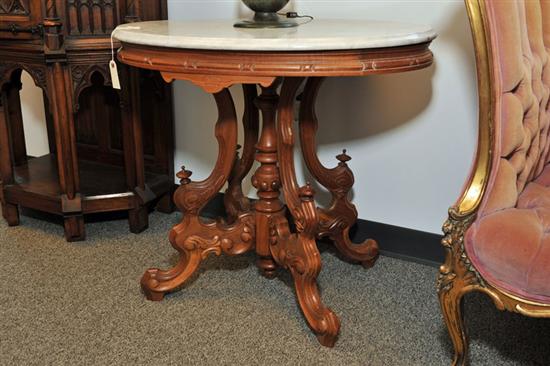 Appraisal: VICTORIAN MARBLE TOP TABLE White oval top on a walnut