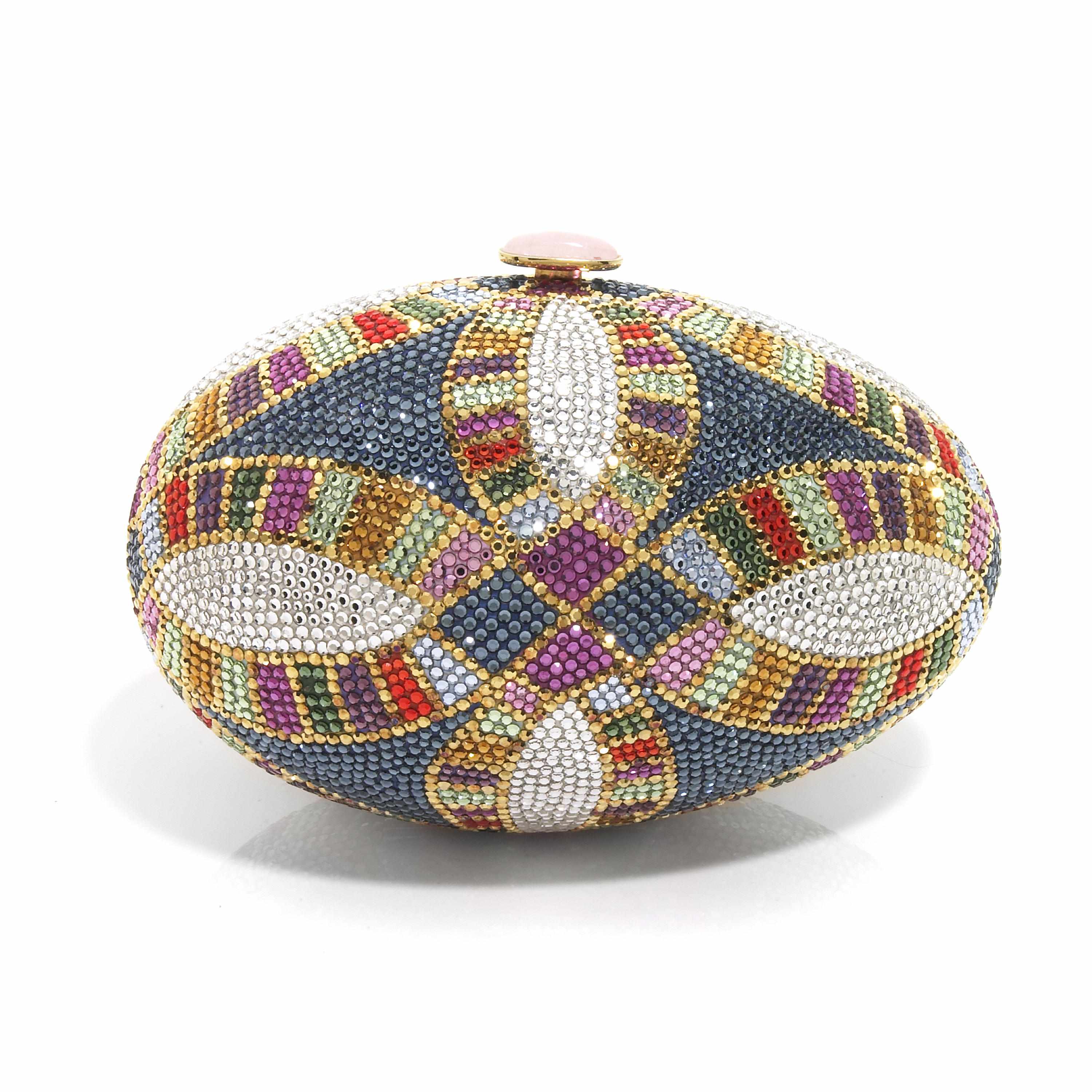 Appraisal: A multi-colored crystal egg purse with geometric designs interior with