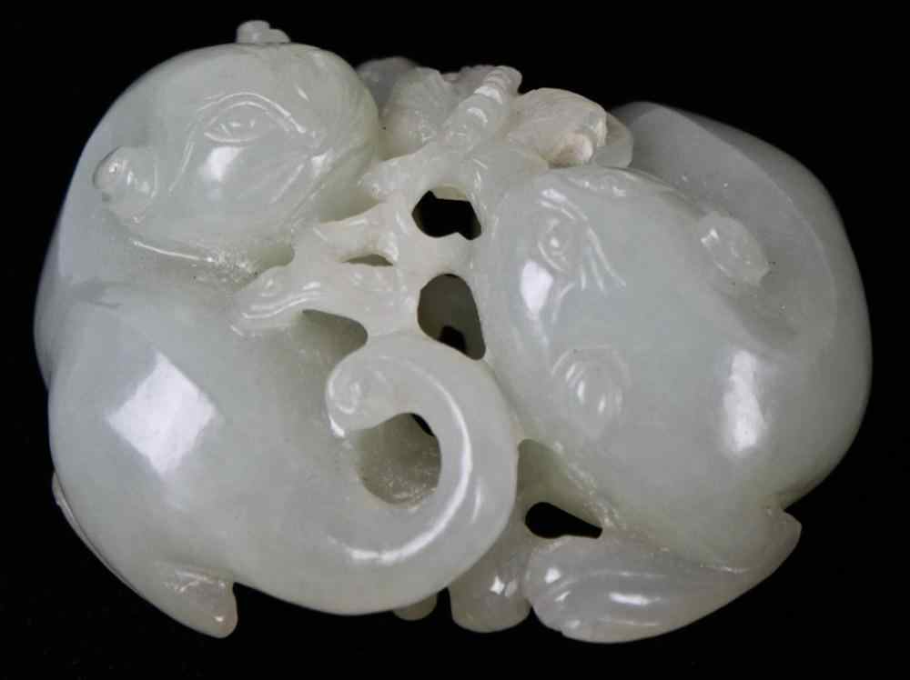 Appraisal: CHINESE WHITE JADE CARVING OF TWO CATS the material of