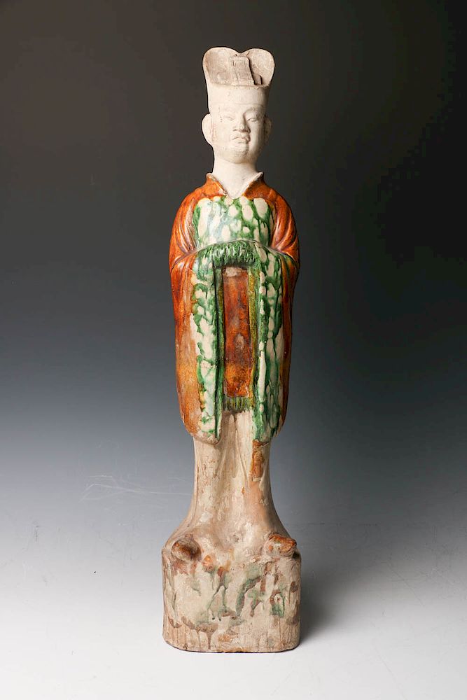 Appraisal: CHINESE SANCAI GLAZE IMPERIAL ATTENDANT FIGURE TANG DYNASTY The standing