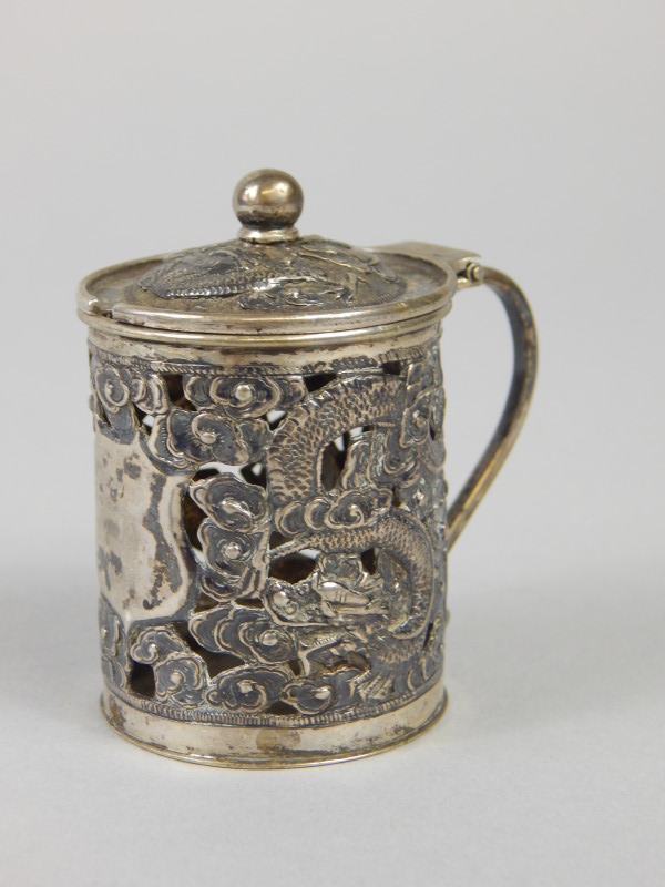 Appraisal: A Chinese white metal mustard pot with hinged lid decorated