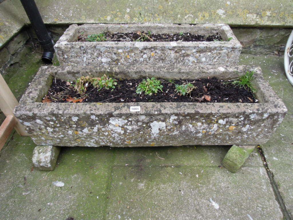 Appraisal: A pair of weathered composition stone garden troughs of rectangular