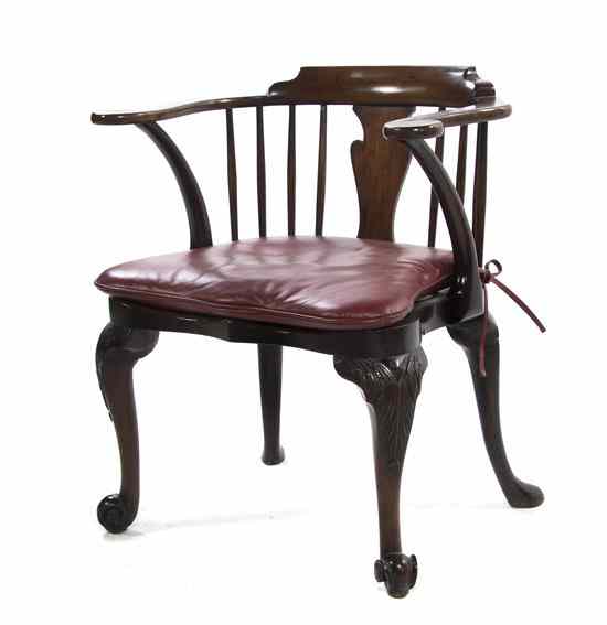 Appraisal: A George II Mahogany Library Armchair having a curved crest