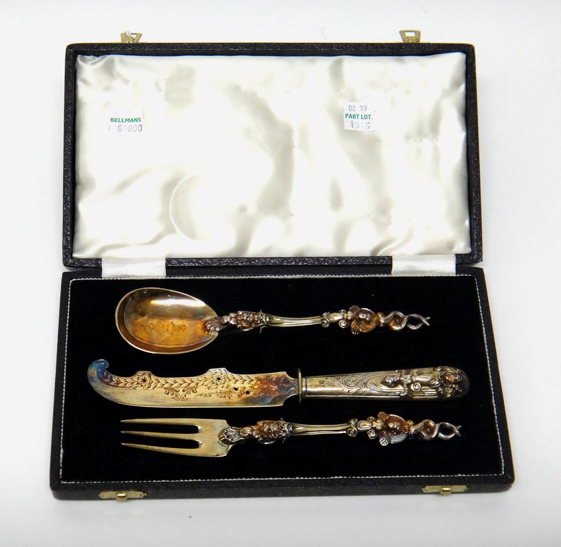 Appraisal: A European gilt three piece christening set comprising a knife