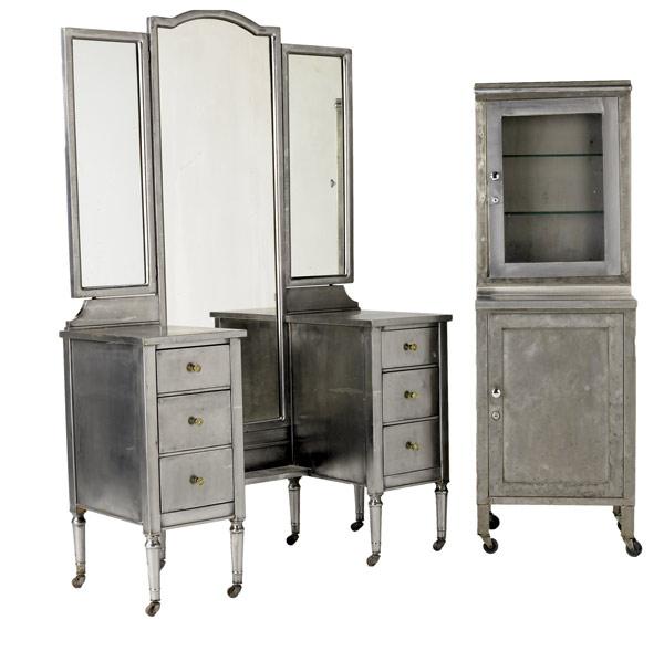 Appraisal: BRUSHED STEEL FURNITURE Six drawer mirrored vanity together with a