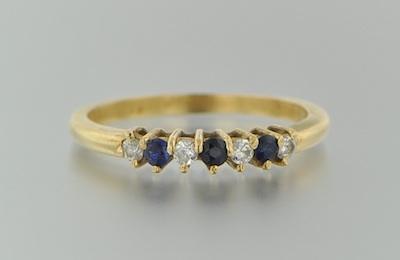 Appraisal: A Diamond and Sapphire Band k yellow gold band set