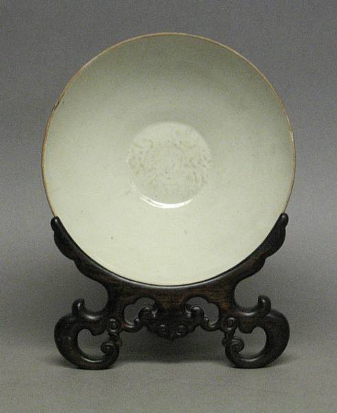 Appraisal: A Song style white glazed stoneware bowl Unglazed rim reduced