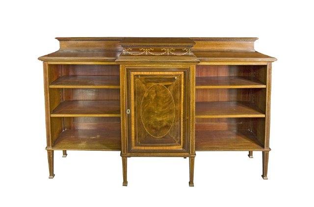 Appraisal: An Edwardian mahogany breakfront open bookcase the centre with husk