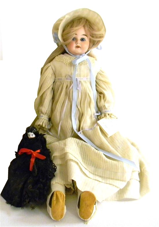 Appraisal: German bisque head doll blonde hair and blue eyes white