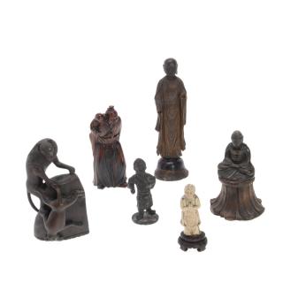 Appraisal: Group Asian hardwood or bronze figures Group Asian hardwood or