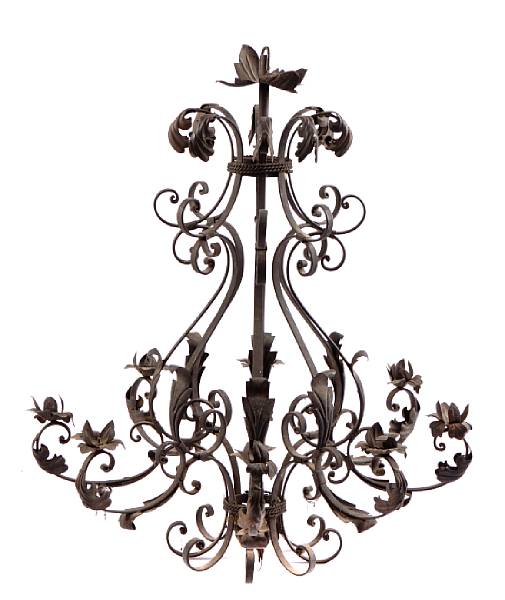 Appraisal: A Spanish Baroque style wrought iron and tole eight light