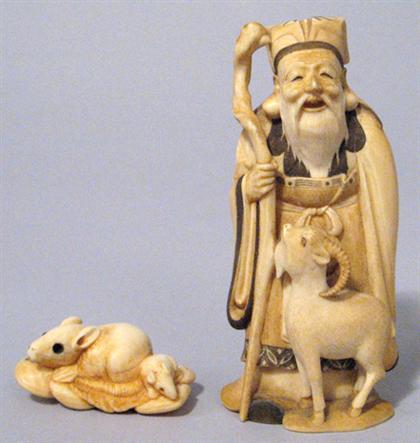 Appraisal: Japanese okimono of a herdsman and goat and netsuke signed