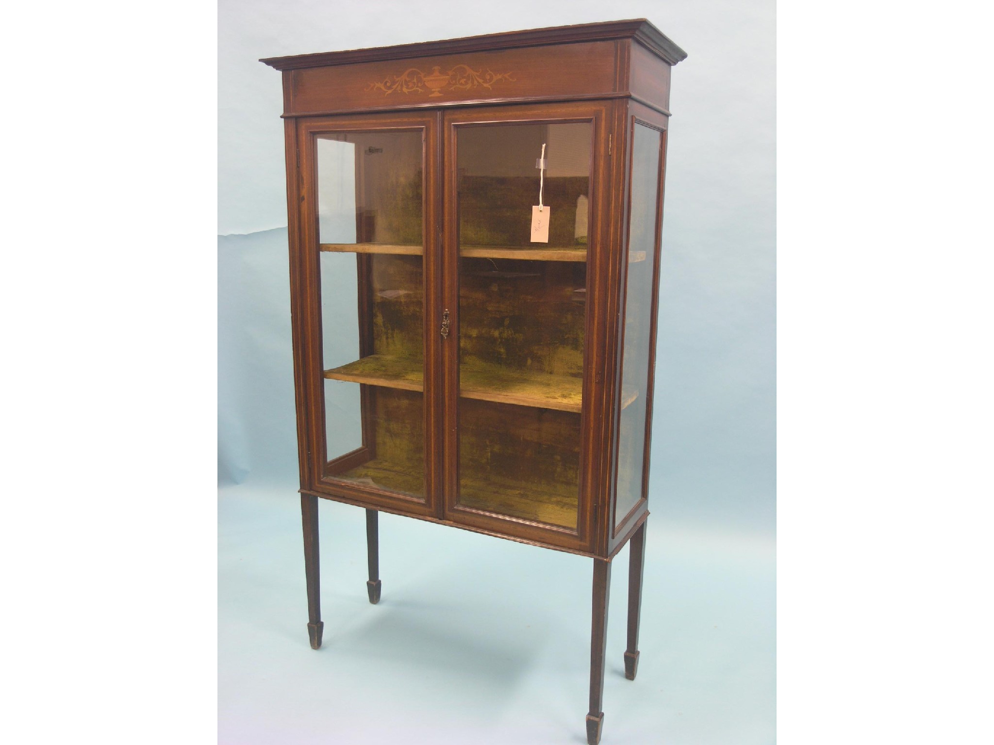 Appraisal: An Edwardian inlaid mahogany display cabinet lined interior with two