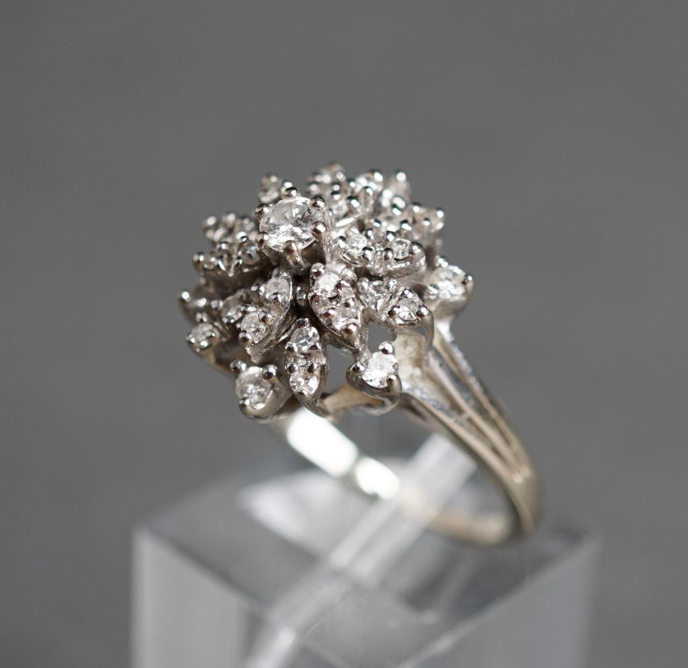 Appraisal: -Karat White-Gold and Diamond Cluster Ring Diamonds weighing approx tcw