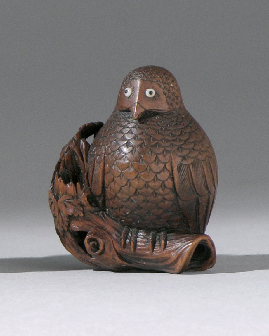 Appraisal: WOOD NETSUKE Meiji PeriodBy Mitsuhiro Depicting an owl with inlaid