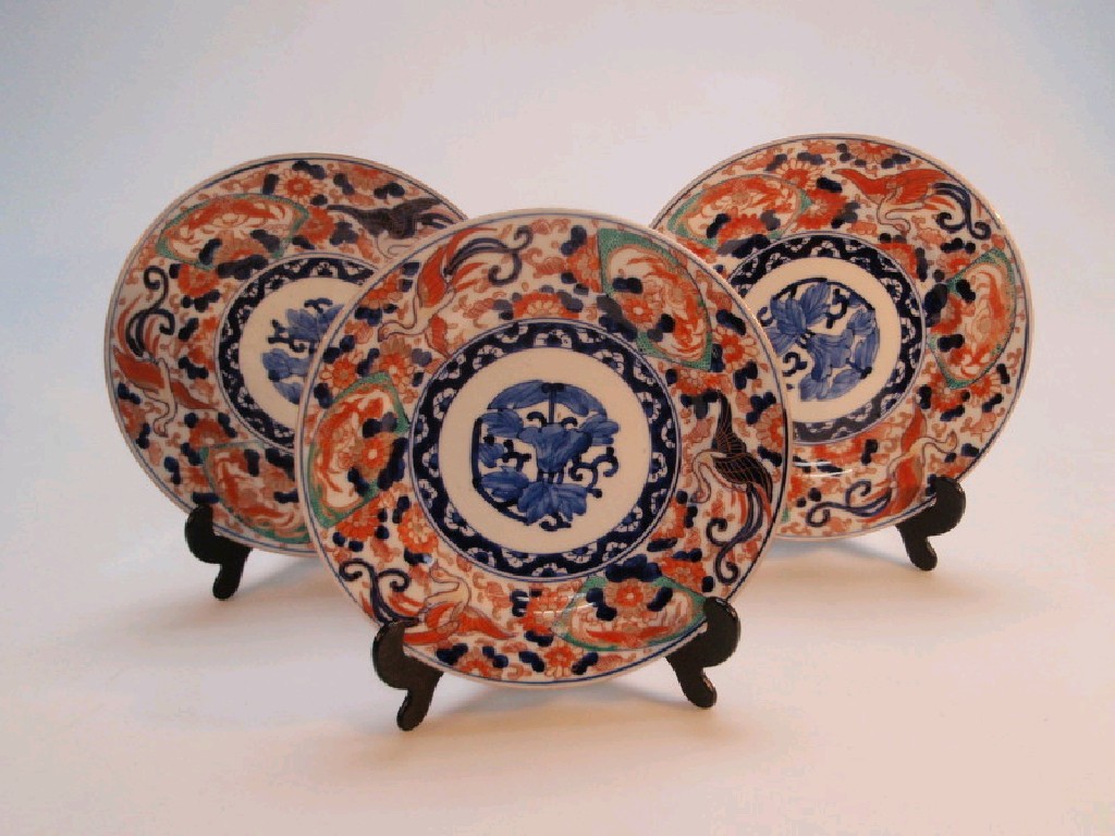 Appraisal: Three Japanese Imari plates decorated with stylized birds flowers and