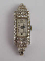 Appraisal: A white metal tests platinum diamond cocktail watch circa approx