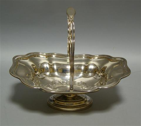 Appraisal: SHEFFIELD PLATE OVAL CAKE BASKET Late Victorian period the scalloped