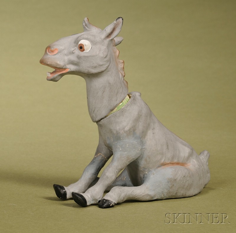 Appraisal: German Papier-mache Donkey Candy Container c the animal seated on