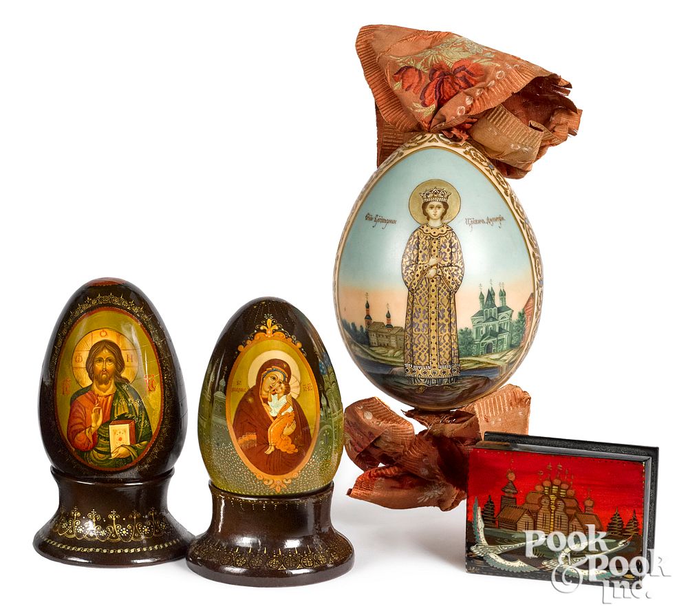 Appraisal: Three Russian painted eggs together with a box Three Russian