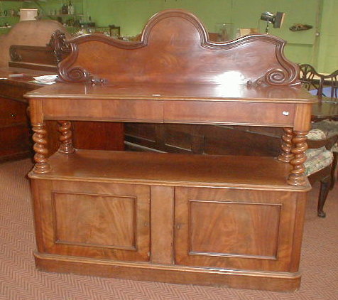 Appraisal: A Victorian mahogany buffet with barley twist supports