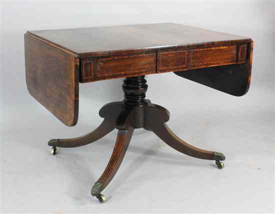 Appraisal: A Regency inlaid rosewood sofa table with foliate scroll banding