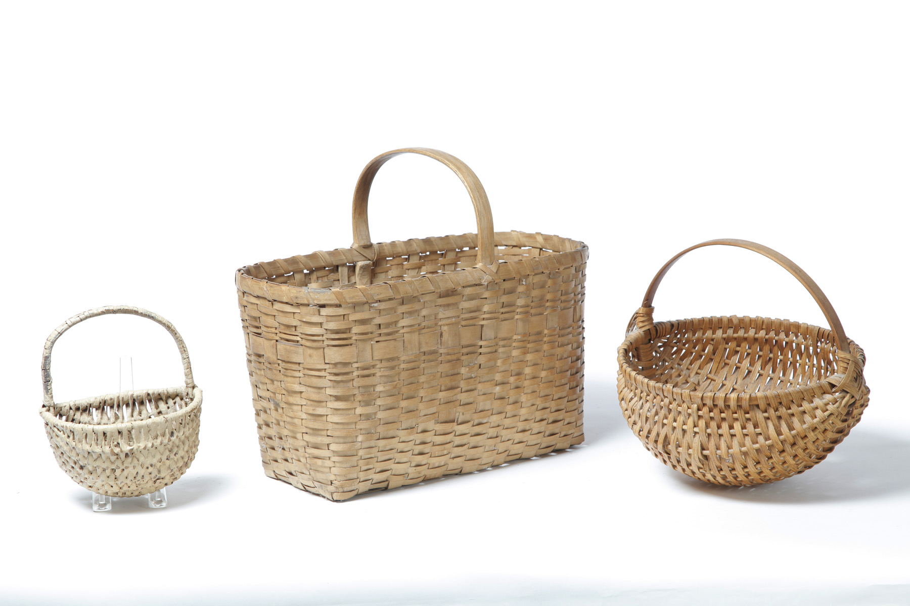 Appraisal: THREE BASKETS American late th-early th century woven splint Bentwood