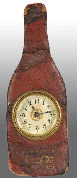 Appraisal: Coca-Cola Leather Bottle Advertising Clock Description porcelain dial Circa Excellent