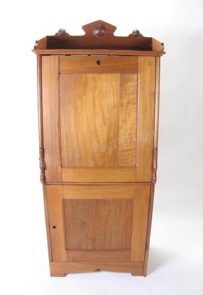 Appraisal: An antique walnut desk secretary with slant front fitted interior