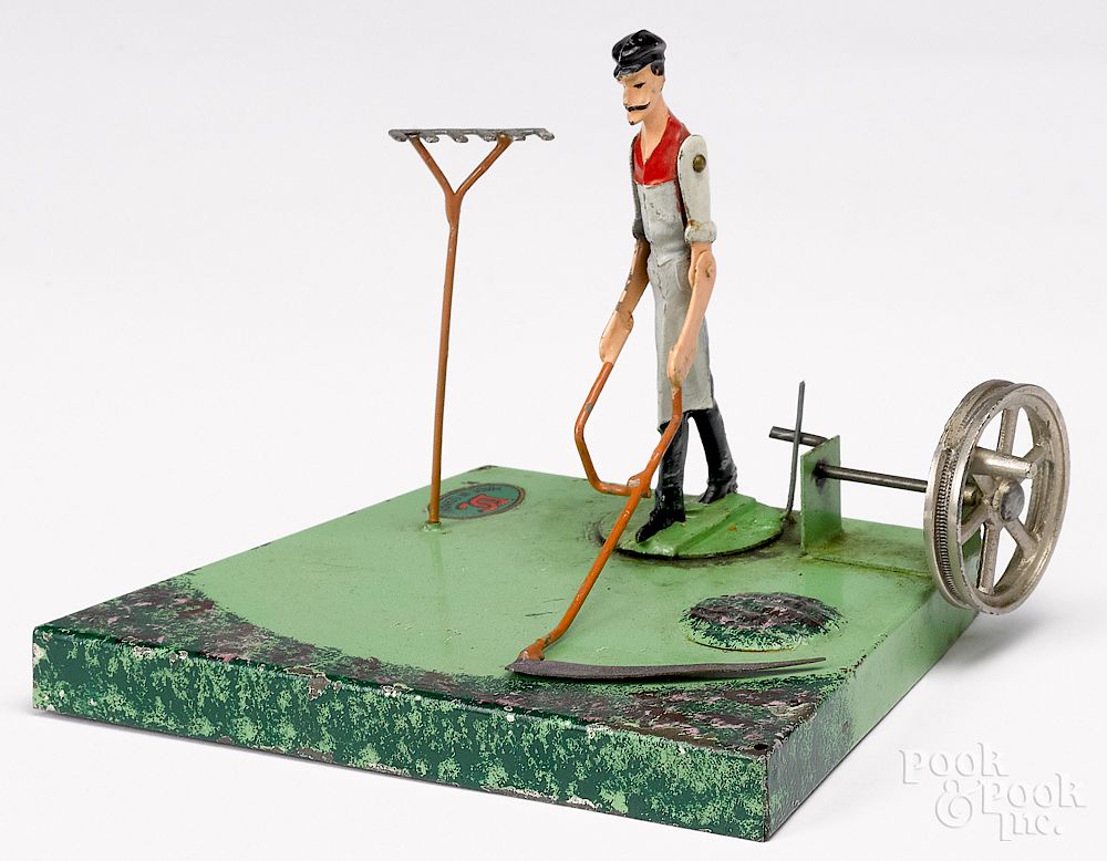 Appraisal: Man with scythe steam toy accessory Doll painted tin man