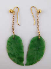 Appraisal: A pair of jade drop earrings the jade carved as