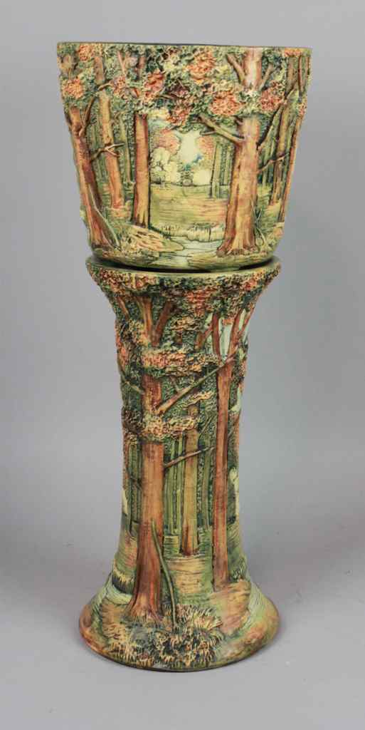 Appraisal: WELLER POTTERY FOREST PATTERN URN AND PEDESTAL each decorated in