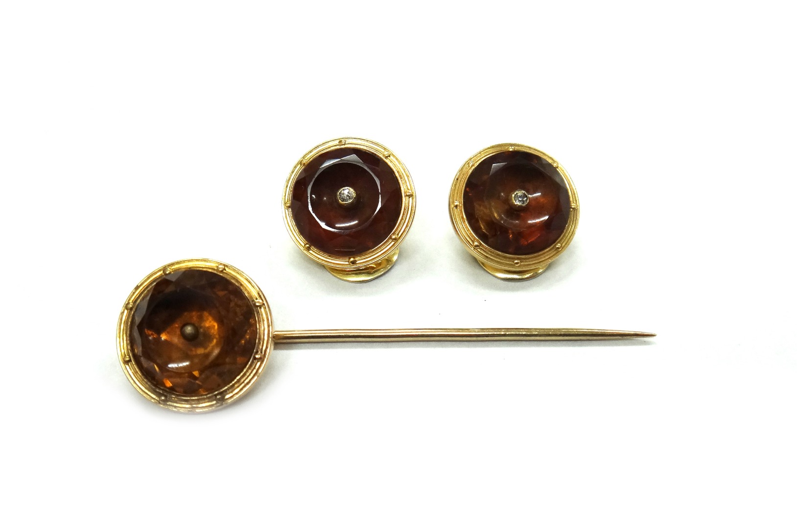 Appraisal: Three early th century gold and citrine coloured quartz buttons