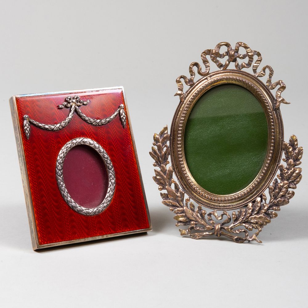 Appraisal: Two Faberge Style Silver Picture Frames The red enameled Italian