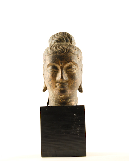 Appraisal: A Brass Buddhist Head on a wood base high