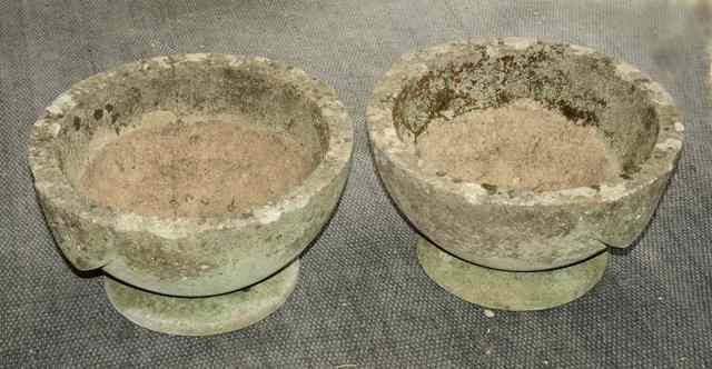 Appraisal: A PAIR OF WEATHERED COMPOSITION GARDEN URNS of classical tapering