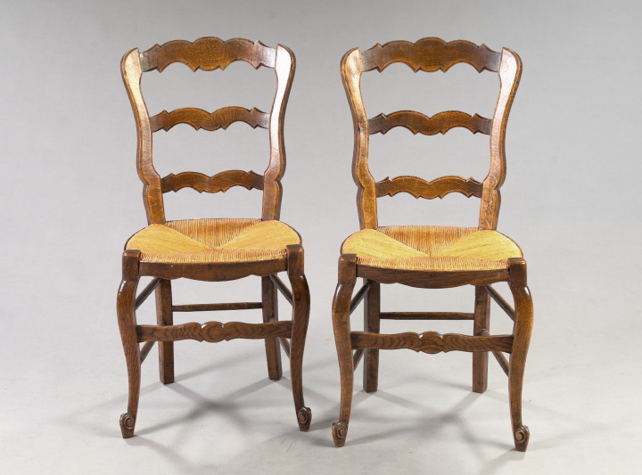 Appraisal: Pair of French Provincial Oak Sidechairs early th century each