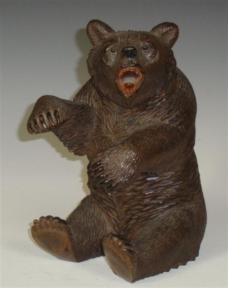 Appraisal: A Black Forest carved wood model of a bear seated