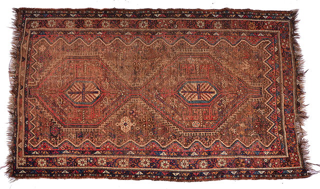 Appraisal: AN OLD ORIENTAL BLUE GROUND RUG with three central diamond