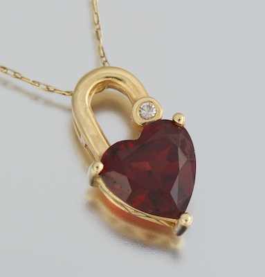 Appraisal: A Ladies' Garnet and Diamond Heart Pendant on Chain k