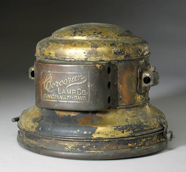 Appraisal: A Corcoran Lamp Co acetylene headlamp shell Cincinnati circa fork