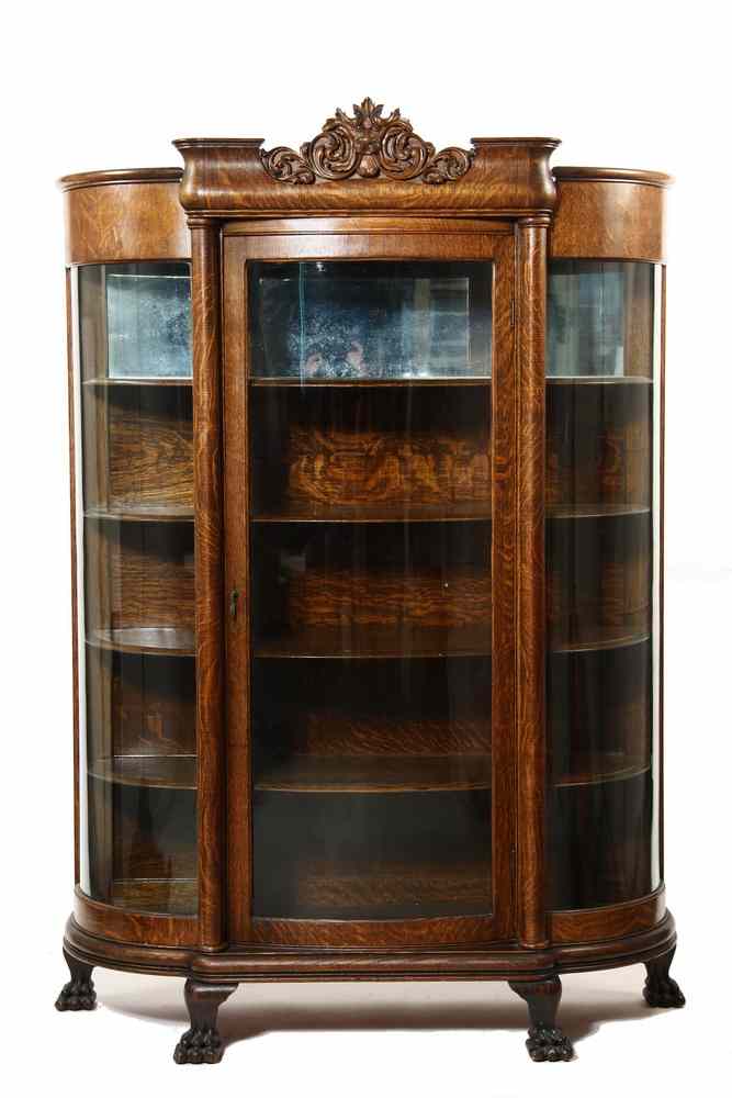 Appraisal: CHINA CABINET - Circa oversized triple bowed glass oak china