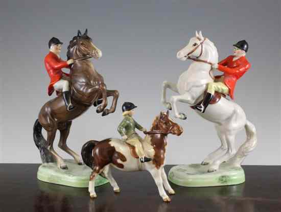 Appraisal: Two Beswick figures of huntsmen on a rearing horse model