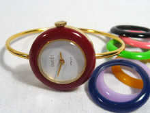 Appraisal: A ladies Gucci wrist watch with multicoloured interchangeable bezels