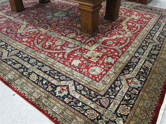 Appraisal: HAND KNOTTED ORIENTAL CARPET Indo-Persian overall floral design on red