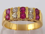 Appraisal: A yellow metal tests carat gold ruby and diamond ring