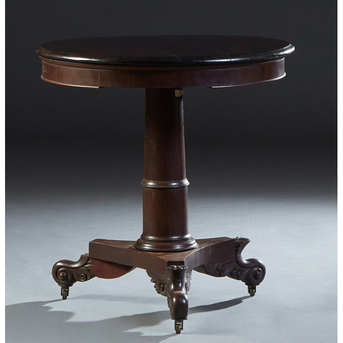 Appraisal: American Classical Carved Mahogany Lamp Table th c the rounded